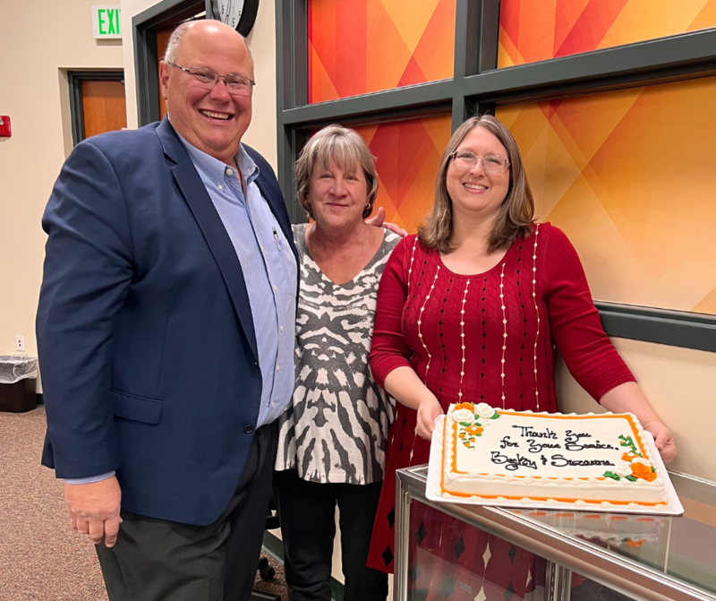 Board president Tony Rebottaro poses for a photo with Suzanne Moore and Rebecca Brooks